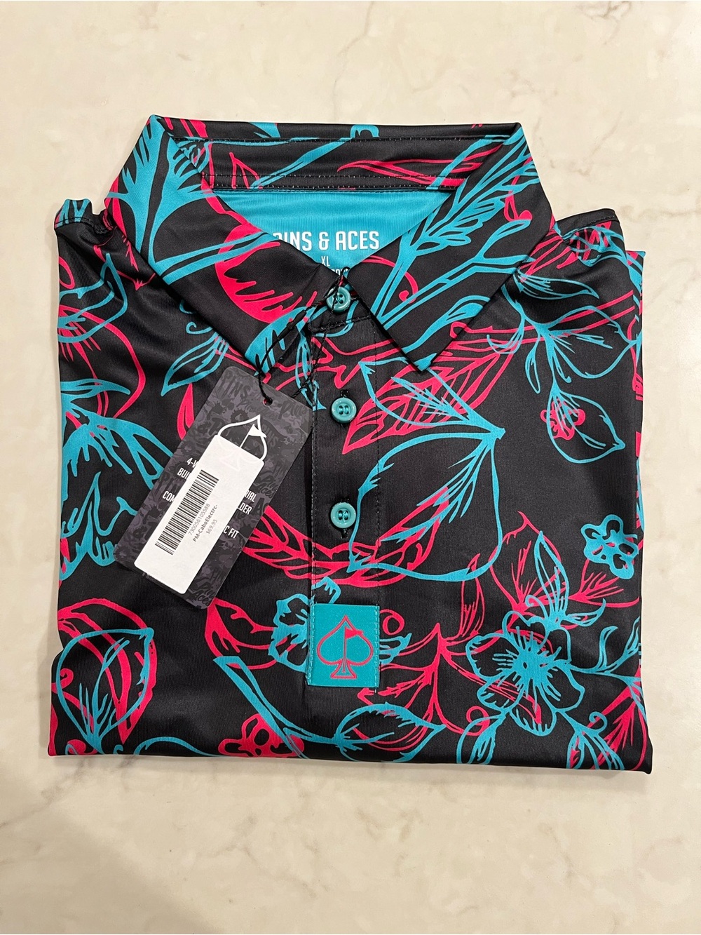 Pins & Aces Men’s Black Golf Polo with Teal & Pink Floral Print NWT